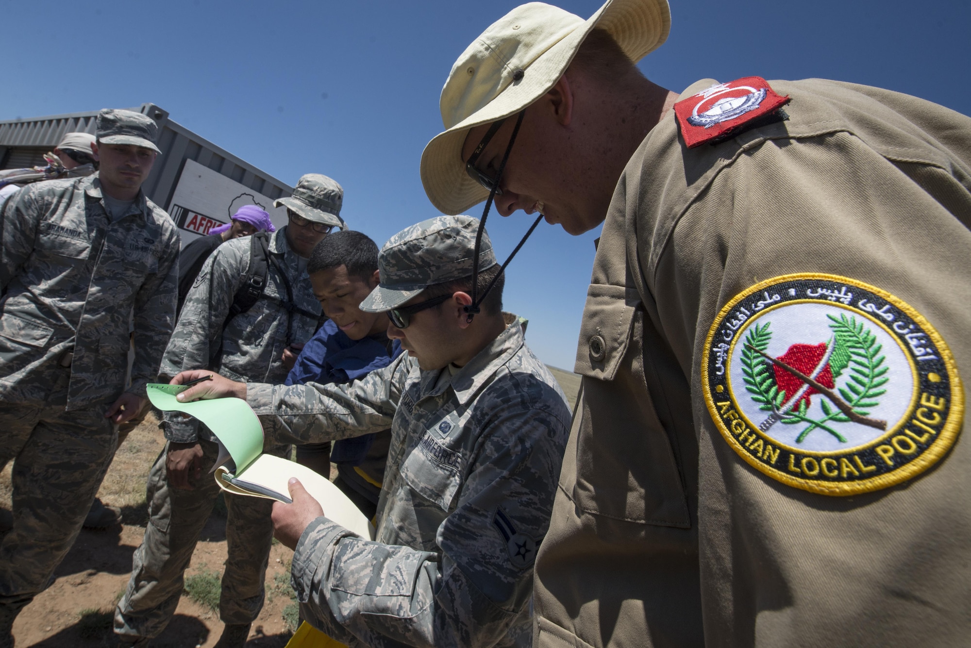 Air Commandos with the 27th Special Operations Contracting Squadron and the 27th Special Operations Comptroller Squadron negotiate prices for vehicles with Airmen posing as local nationals June 14, 2016 at Melrose Air Force Range, N.M. The squadrons spent a week at MAFR honing their ability to run finance and contracting operations in a deployed environment. (U.S. Air Force photo/Senior Airman Shelby Kay-Fantozzi)