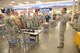 Staff Sgt. Brandon Gomez, far right, gives opening instructions as a MILO film crew prepares to film an active shooter scenario in the Base Exchange food court Oct. 5. Security Forces personnel will use the film to train on the base’s simulator. (Photo by Todd Berenger)