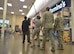 MILO representatives film a mock active-shooter scenario in the Base Exchange food court as Airmen follow their work.  Security Forces personnel will use the film to train on the base’s simulator. (Photo by Todd Berenger)