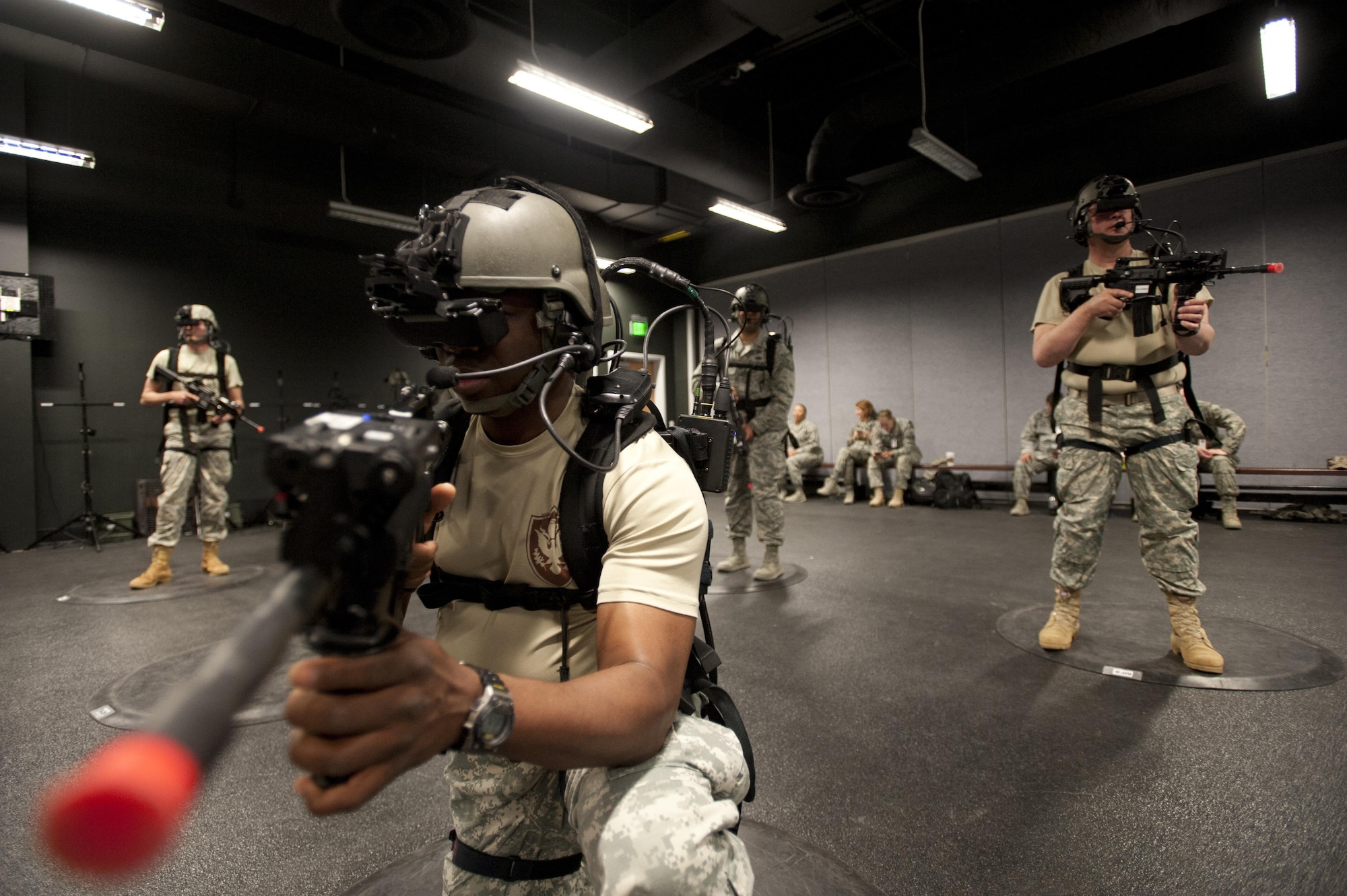 U.S. Department of Defense civilian Cedric Rahning and other trainees use a Dismounted Soldier Training System to prepare for deployment during Operational Contract Support Joint Exercise 2015, March 17. Rahning is a contracting specialist stationed at U.S. Army Corps of Engineers, Transatlantic Division, Virginia. (U.S. Air Force photo/Tech. Sgt. Robert Barnett)