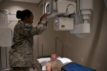 Master Sgt. Tracey McLendon, 23d Medical Support Squadron flight chief of diagnostic imaging, prepares a chest X-ray of Senior Airman Jeffrey Nelligan, 355th Medical Support Squadron diagnostic imagining technologist, Oct. 24, 2016, at Moody Air Force Base, Ga. The 23d MDSS radiology diagnostic imaging section consists of two Airmen who are responsible for the X-rays of approximately 10,000 people. (U.S. Air Force photo by Airman 1st Class Daniel Snider)
