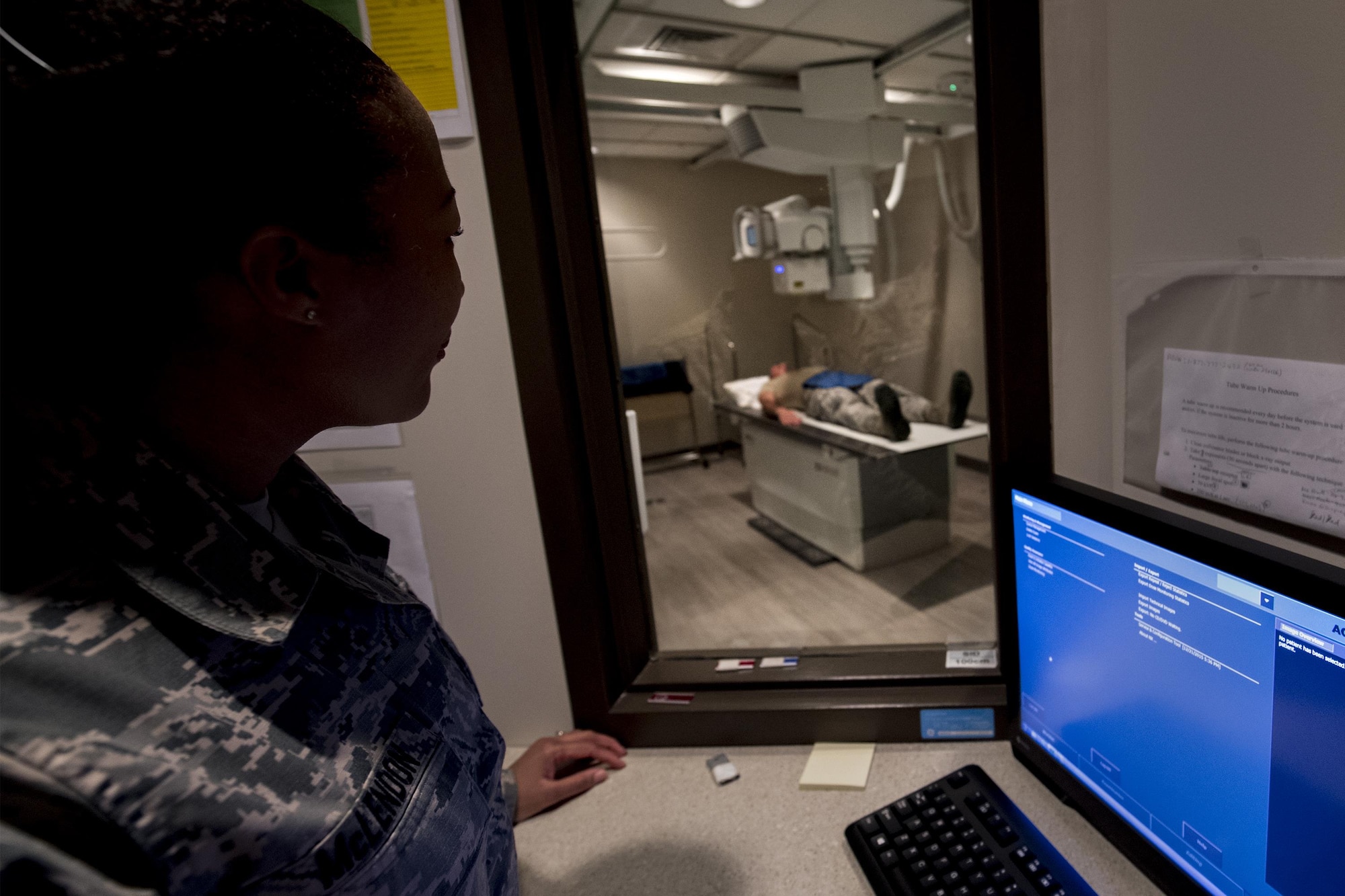 Master Sgt. Tracey McLendon, 23d Medical Support Squadron flight chief of diagnostic imaging, performs an X-ray on Senior Airman Jeffrey Nelligan, 355th Medical Support Squadron diagnostic imagining technologist, Oct. 24, 2016, at Moody Air Force Base, Ga. New technologies have allowed for Moody’s X-rays to be processed and seen more quickly. (U.S. Air Force photo by Airman 1st Class Daniel Snider)