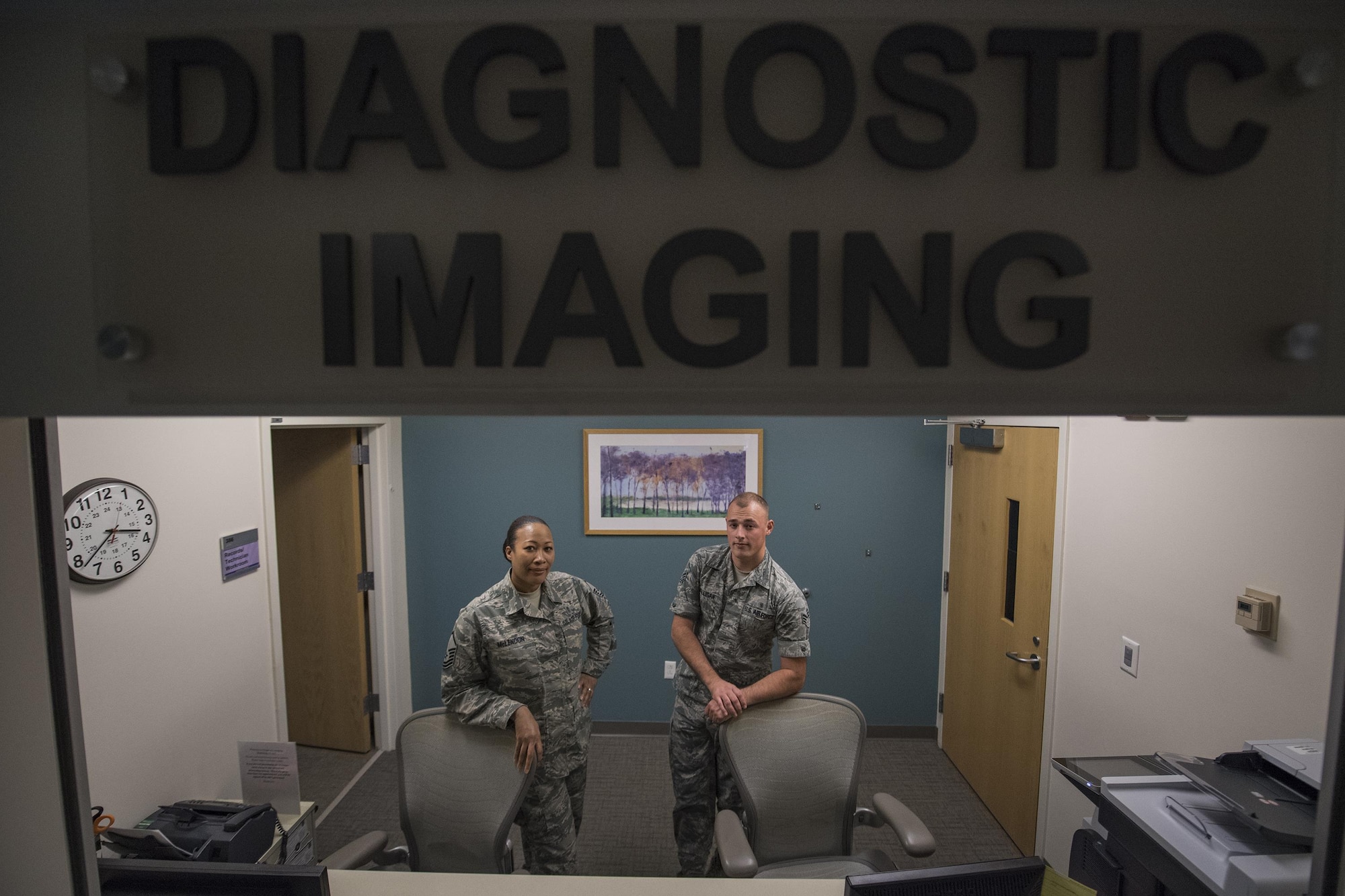 Master Sgt. Tracey McLendon, 23d Medical Support Squadron flight chief of diagnostic imaging, and Senior Airman Jeffrey Nelligan, 355th Medical Support Squadron diagnostic imagining technologist, pose for a photo at the front desk of the radiology section, Oct. 24, 2016, at Moody Air Force Base, Ga. Without the radiology section, the timeliness of diagnosis could slow drastically and patients would be forced to find a local clinic or hospital for their imaging. (U.S. Air Force photo by Airman 1st Class Daniel Snider)