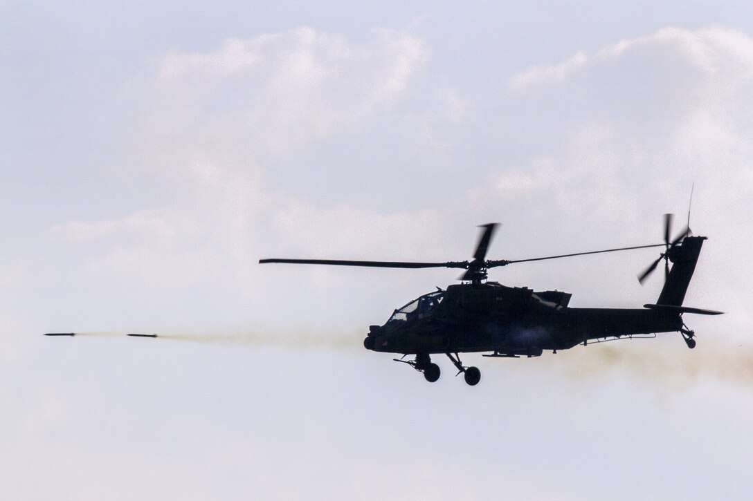 Army pilots fire 2.75-inch rockets from an AH-64D Apache helicopter during an aerial gunnery exercise at Fort Stewart, Ga., Oct. 21, 2016. Army photo by Spc. Scott Lindblom