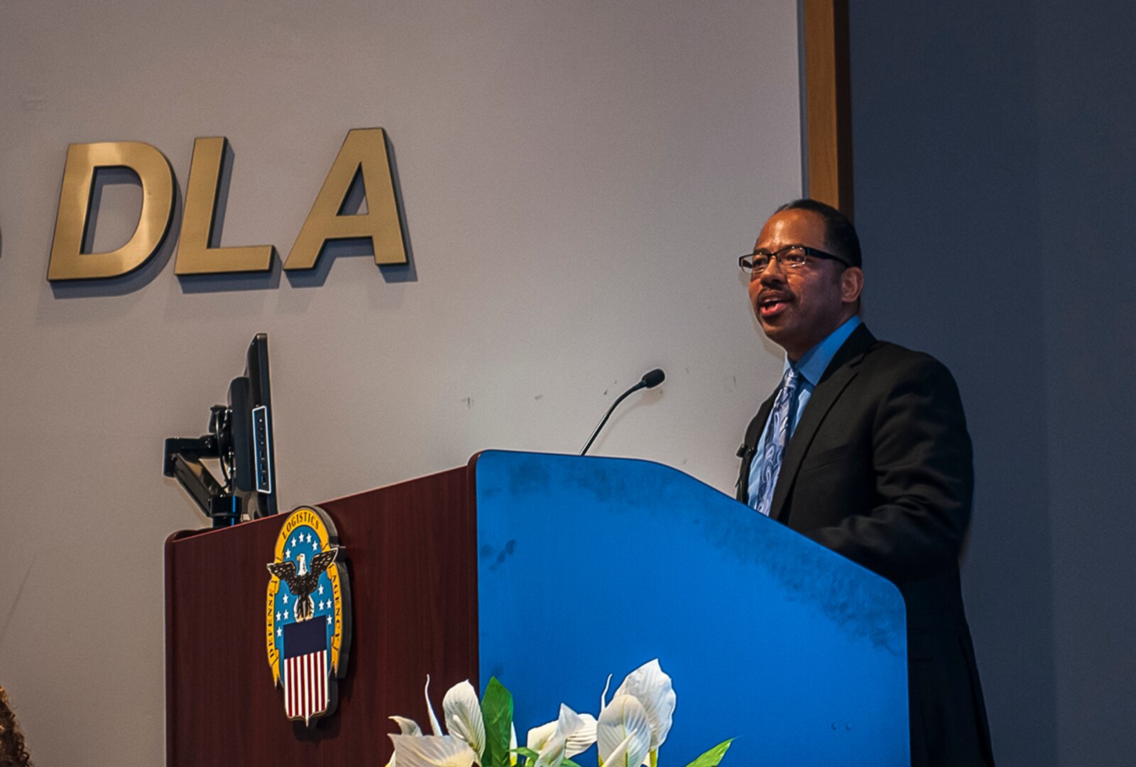 James Clinkscale, a diversity and inclusion manager at Opportunities for Ohioans with Disabilities, speaks to an audience at DLA Land and Maritime during an observance for National Disability Awareness Month.