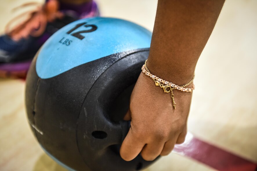 Senior Airman Tanaysha Redding, physical training rehab course participant, prepares to do a medicine ball workout during PTRC at Barksdale Air Force Base, La., October 25, 2016. PTRC uses lower, upper and full body exercises to create strength and endurance in participants. (U.S. Air Force photo/Senior Airman Luke Hill)