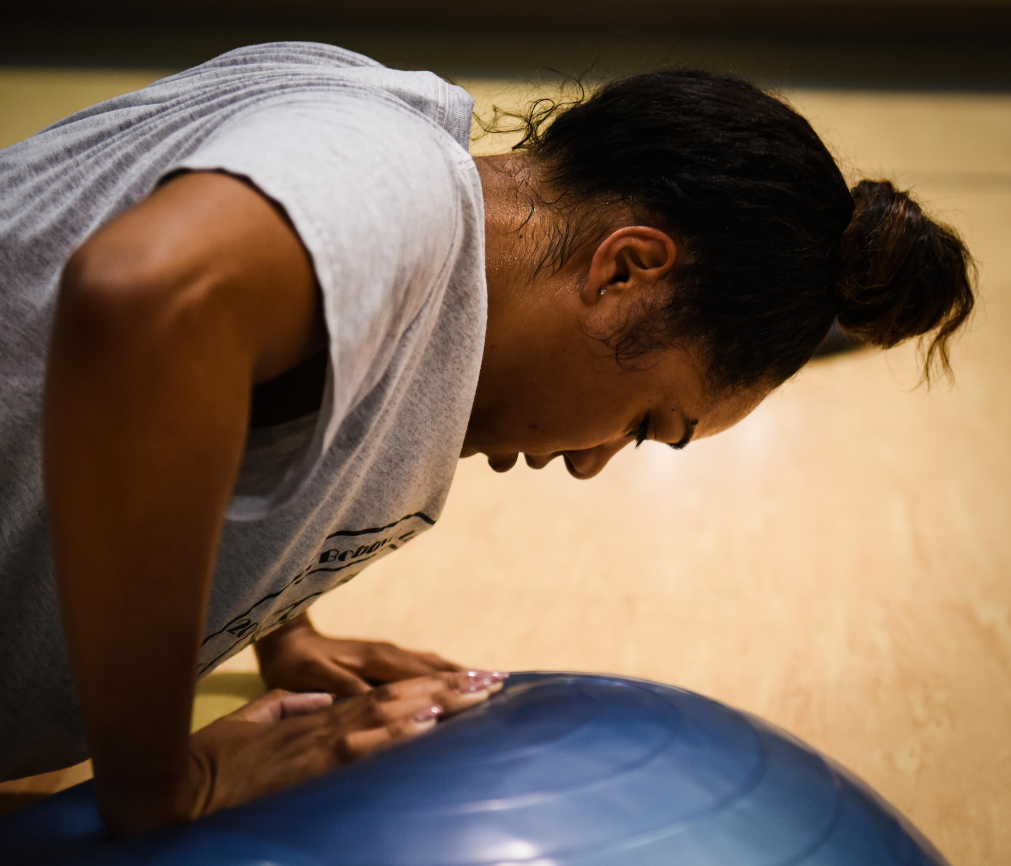 Senior Airman Adrienne Granadil, physical training rehab course participant, performs push-ups on a bosu ball during PTRC at Barksdale Air Force Base, La., October 25, 2016. PTRC is run by experienced medical and fitness personnel to ensure exercises are safe and effective. (U.S. Air Force photo/Senior Airman Luke Hill)