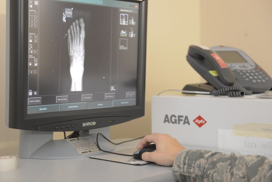 A 5th Medical Support Squadron radiology technologist reviews an x-ray at Minot Air Force Base, N.D., Oct. 25, 2016. Radiology technologists forward all captured x-ray imagery to radiologists at Travis AFB, California, for further assessment. (U.S. Air Force photo/Airman 1st Class Jessica Weissman)
