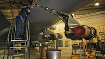 (Left to right) Airman 1st Class Madison Ferguson, 5th Maintenance Squadron phase crew chief, and Senior Airman Theodore Amundsen, 5 MXS phase jet mechanic, perform maintenance on a B-52H Stratofortress’ right wing at Minot Air Force Base, N.D., Oct. 21, 2016. Phase maintainers complete in-depth inspections on aircraft parts that can’t be fixed on the flightline. (U.S. Air Force photo/Airman 1st Class J.T. Armstrong) 