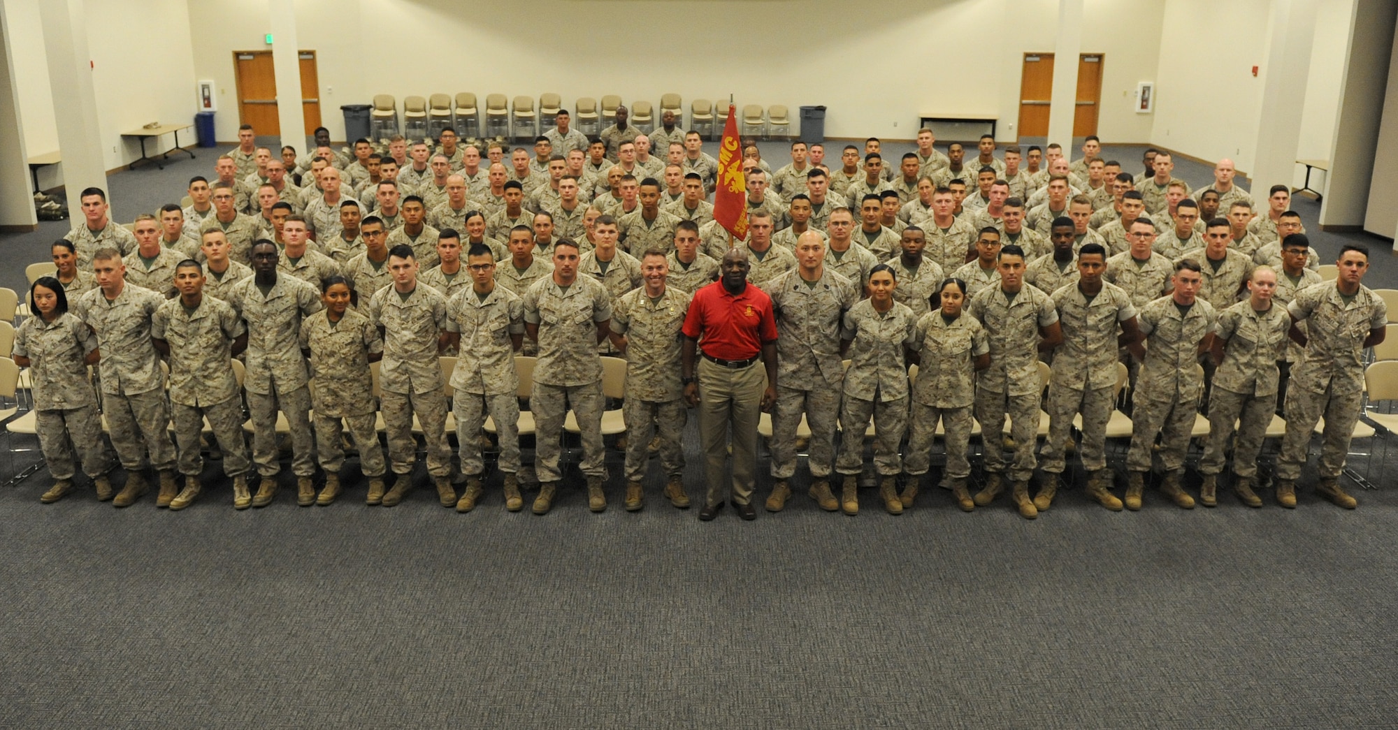 Sergeant Major of the Marine Corps Ronald Green poses for a group photo with members of the Keesler Marine Detachment at the Roberts Consolidated Aircraft Maintenance Facility Oct. 26, 2016, on Keesler Air Force Base, Miss. Green spoke on the current and future stance of the Marine Corps and the impact the young Marines have on its future. (U.S. Air Force photo by Kemberly Groue/Released)