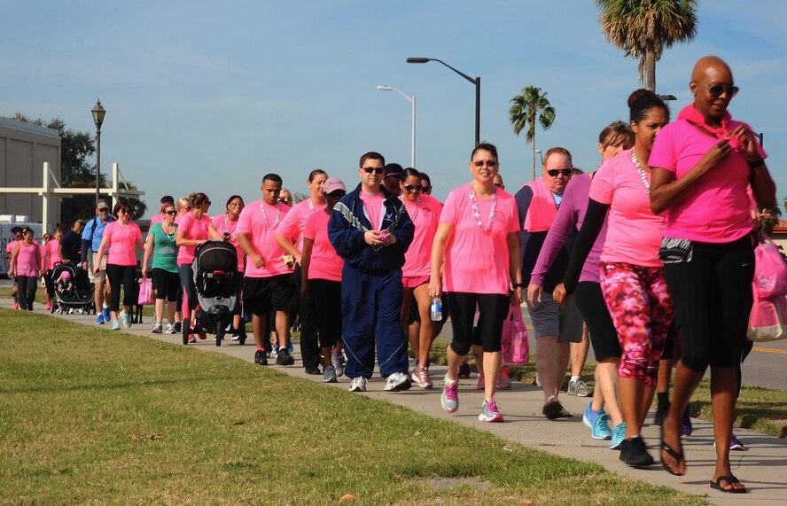 Members of Team MacDill begin the two-mile walk during the second annual Breast Cancer Awareness Walk at MacDill Air Force Base, Fla., Oct. 25, 2016. Breast cancer survivors led the pack down Bayshore Boulevard with supporters close behind. (U.S. Air Force photo by Airman Adam R. Shanks)