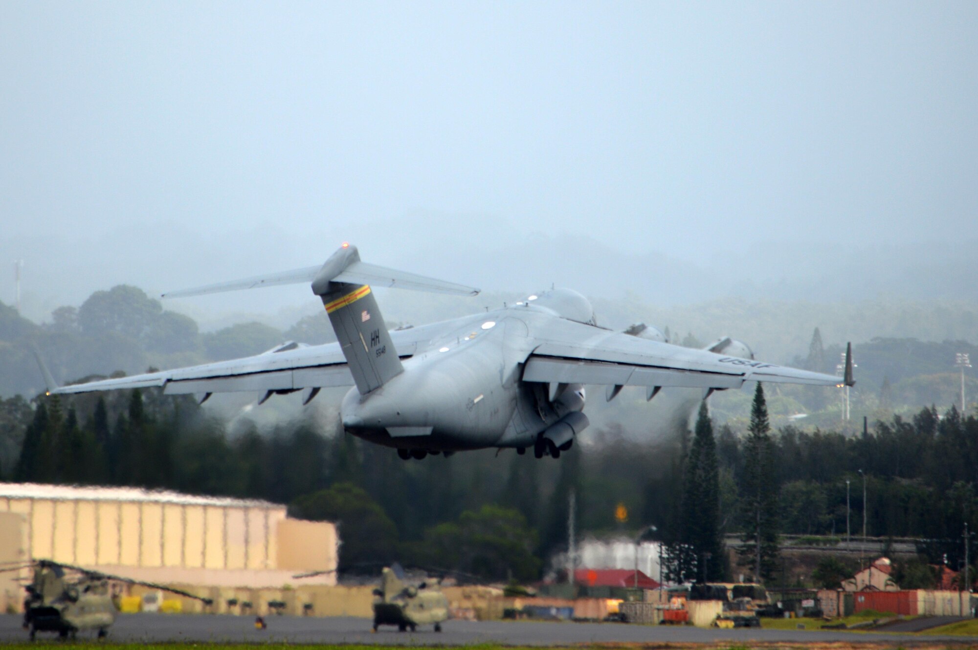 A U.S. Air Force C-17 Globemaster III assigned to the 535th Airlift Squadron, 15th Wing, takes off from Wheeler Army Airfield, Hawaii with Soldiers and equipment assigned to the 3rd Brigade Combat Team, 25th Infantry Division, on Oct. 24, 2016. The Soldiers are heading to the Pohakuloa Training Area on the island of Hawaii to participate in Lightning Forge 17. (U.S. Army photo by Staff Sgt. Armando R. Limon)
