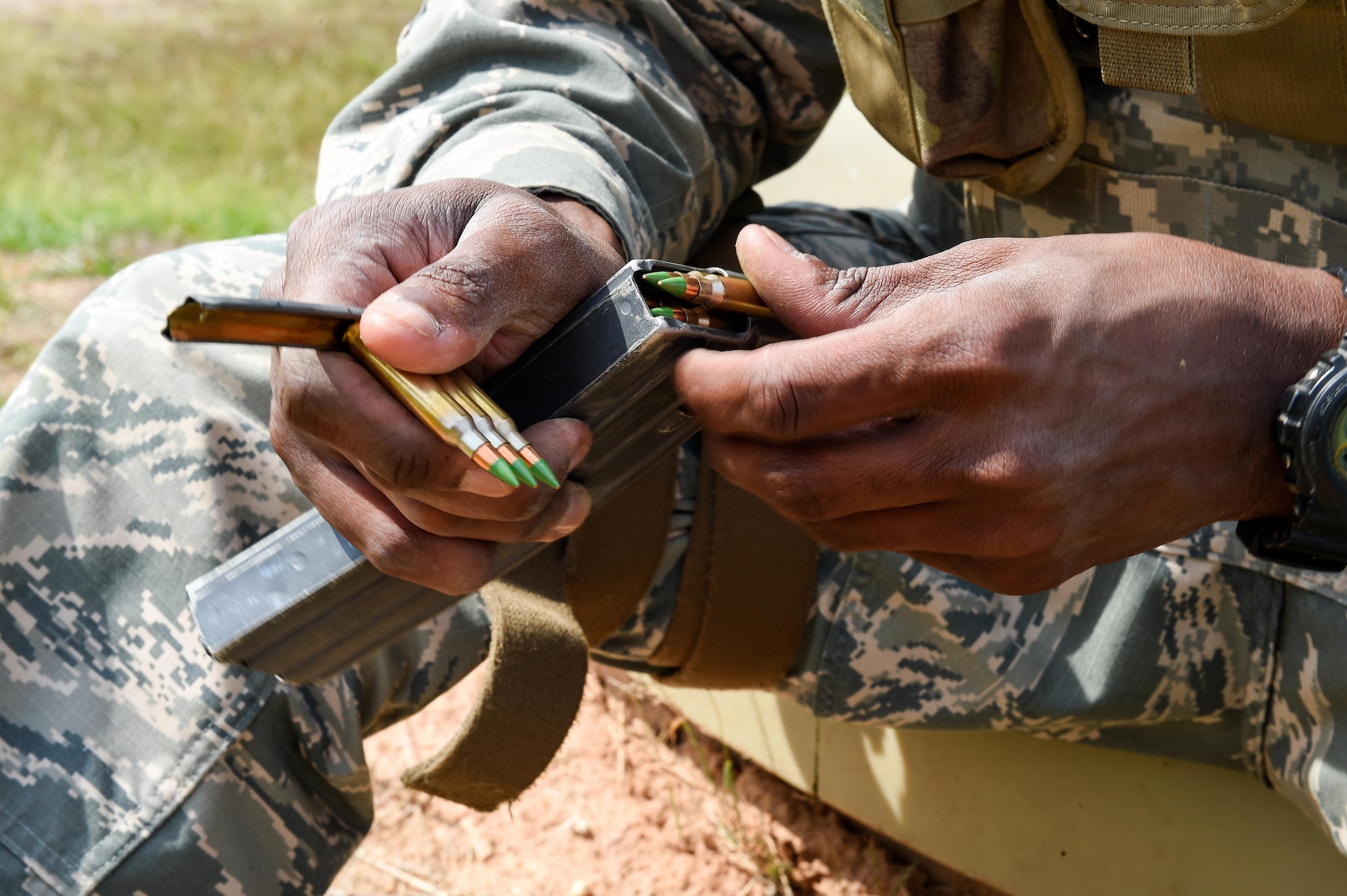 Staff Sgt. Malcolm Patterson, a heating, ventilation and air conditioning technician with the 1st Special Operations Civil Engineer Squadron, loads a magazine during small arms training, part of Task Force Exercise Southern Strike at Camp Shelby, Miss., Oct. 24, 2016. Air Commandos received in-depth weapons training from combat arms training and maintenance instructors with the 1st Special Operations Security Forces Squadron. (U.S. Air Force photo by Senior Airman Jeff Parkinson)