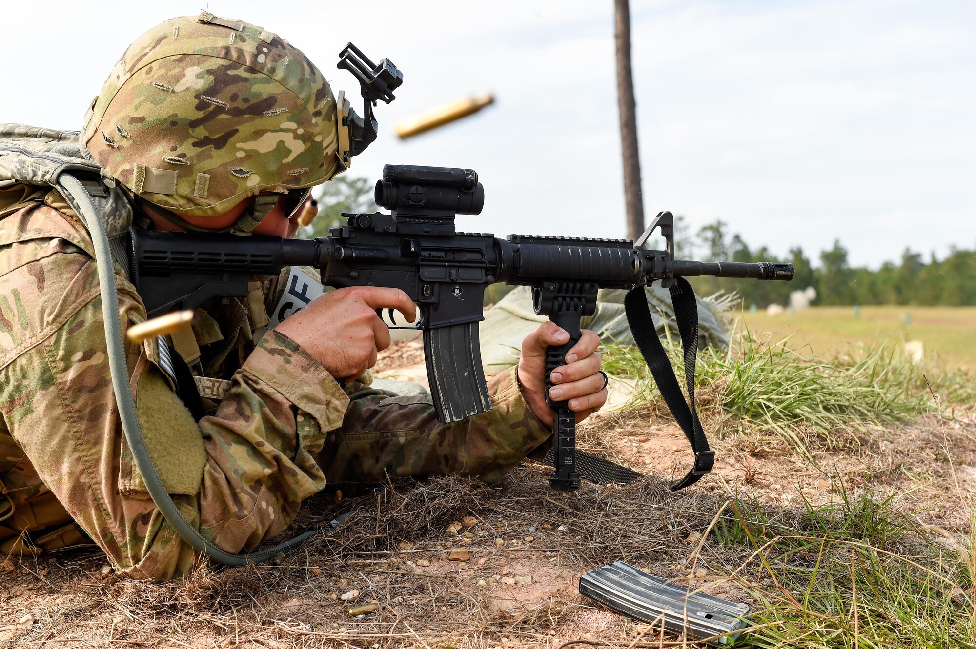 Senior Airman Parker White, a combat arms training and maintenance instructor with the 1st Special Operation Security Forces Squadron, fires his weapon during Task Force Exercise Southern Strike at Camp Shelby, Miss., Oct. 24, 2016. Air Commandos received in-depth weapons training from combat arms training and maintenance instructors with the 1st Special Operations Security Forces Squadron. (U.S. Air Force photo by Senior Airman Jeff Parkinson)