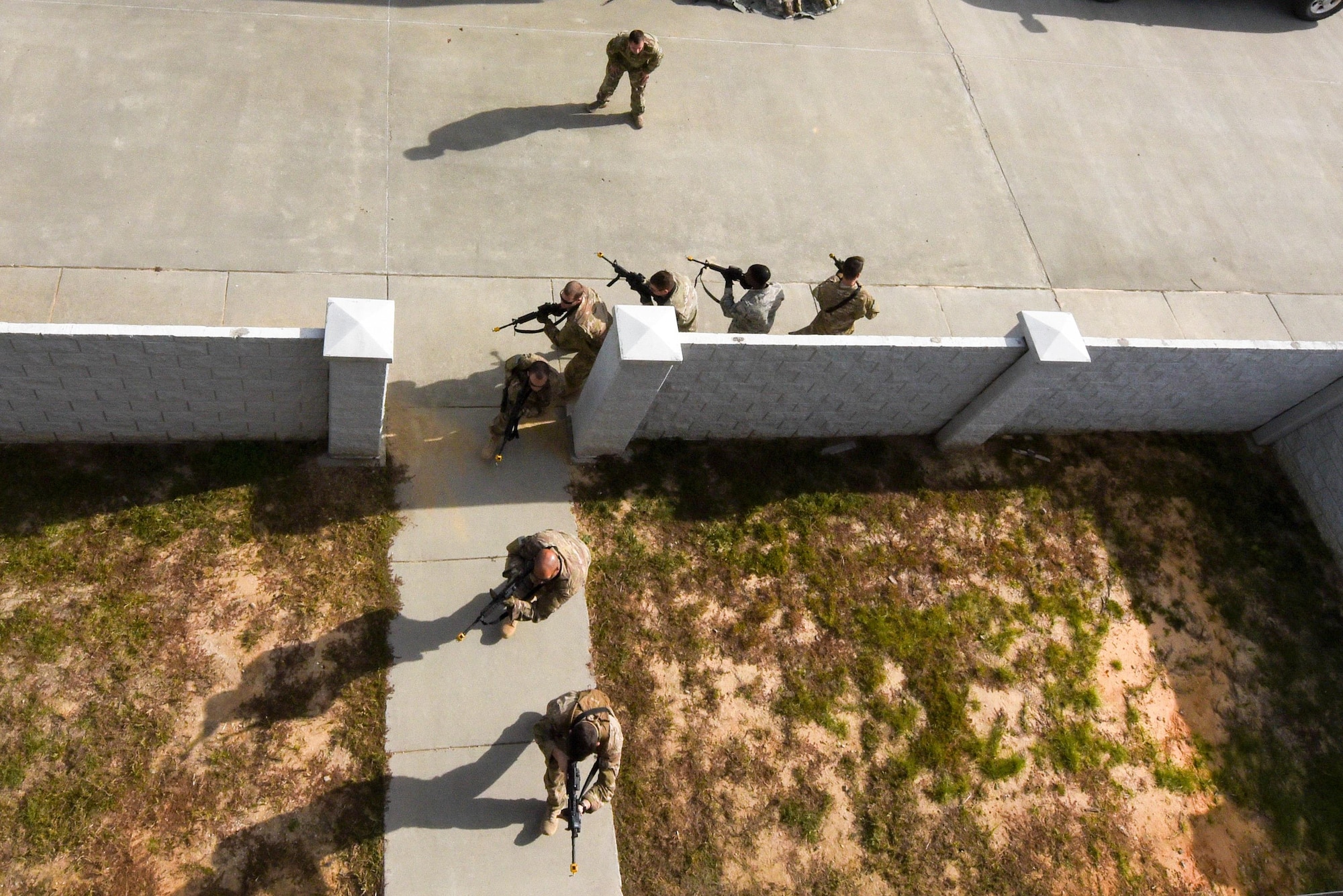 Air Commandos with the 1st Special Operations Mission Support Group enter a building during Task Force Exercise Southern Strike at Camp Shelby, Miss., Oct. 24, 2016. The goal of Southern Strike is to provide advanced tactical training to 1st Special Operations Wing Airmen and other participants. (U.S. Air Force photo by Senior Airman Jeff Parkinson)