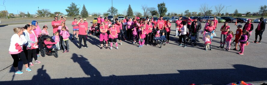 Members of team Ellsworth gather to participate in a Pink Day Parade and 5K event as part of Breast Cancer Awareness Week at Ellsworth Air Force Base, S.D., Oct. 7, 2016. Participants were encouraged to wear pink, the national color for Breast Cancer Awareness Month. (U.S. Air Force photo by Airman 1st Class Denise M. Jenson)
