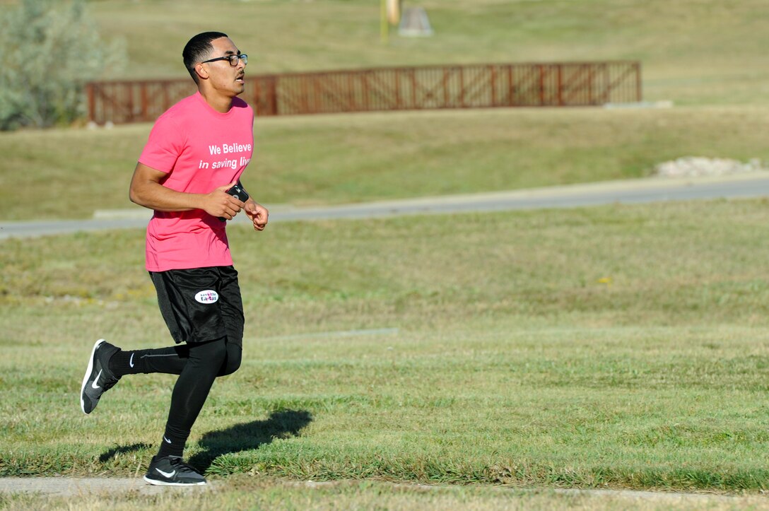 Airman 1st Class Roderick Williams, a bioenvironmental engineering technician assigned to the 28th Medical Operations Squadron, participates in the Pink Day Parade and 5K at Ellsworth Air Force Base, S.D., Oct. 7, 2016. Approximately 100 people participated in the events to show support for breast cancer awareness and prevention. (U.S. Air Force photo by Airman 1st Class Denise M. Jenson)