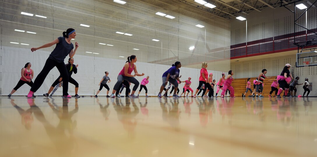 Members of team Ellsworth participate in a Zumbathon as part of Breast Cancer Awareness Week at Ellsworth Air Force Base, S.D., Oct. 6, 2016. Participants were encouraged to wear pink as a way to show support for breast cancer patients and survivors. (U.S. Air Force photo by Airman 1st Class Denise M. Jenson)