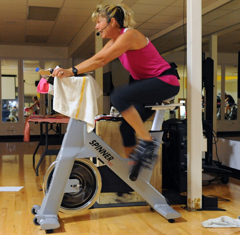 Geri Seal, the health promotion program manager assigned to the 28th Medical Operations Squadron, leads a spin class as part of Breast Cancer Awareness Week at Ellsworth Air Force Base, S.D., Oct. 5, 2016. In addition to spin classes, Ellsworth also hosted a Zumbathon, Pink Day Parade and 5K, as well as helped plan a “ladies night out” event encouraging women to schedule mammogram screenings. (U.S. Air Force photo by Airman 1st Class Denise M. Jenson)