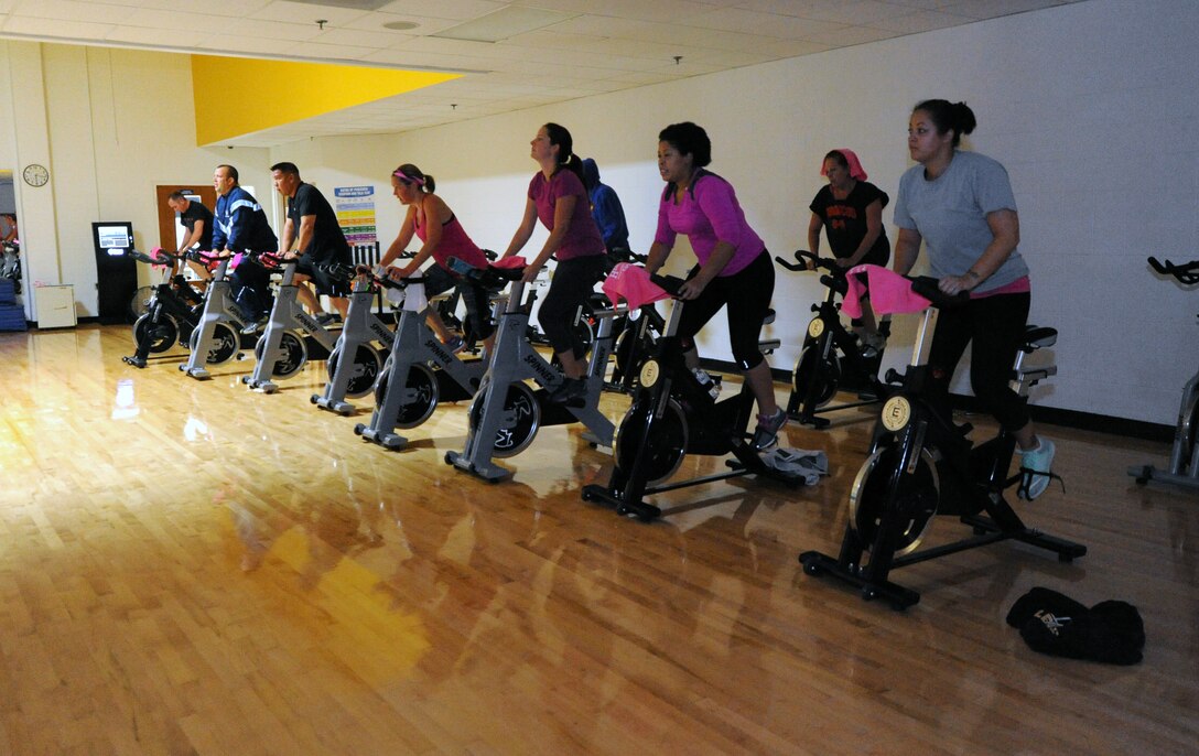 Members of team Ellsworth participate in a spin class as part of Breast Cancer Awareness Week at Ellsworth Air Force Base, S.D., Oct. 5, 2016. According to Breastcancer.org, about one in eight women will develop invasive breast cancer over the course of her lifetime. (U.S. Air Force photo by Airman 1st Class Denise M. Jenson)