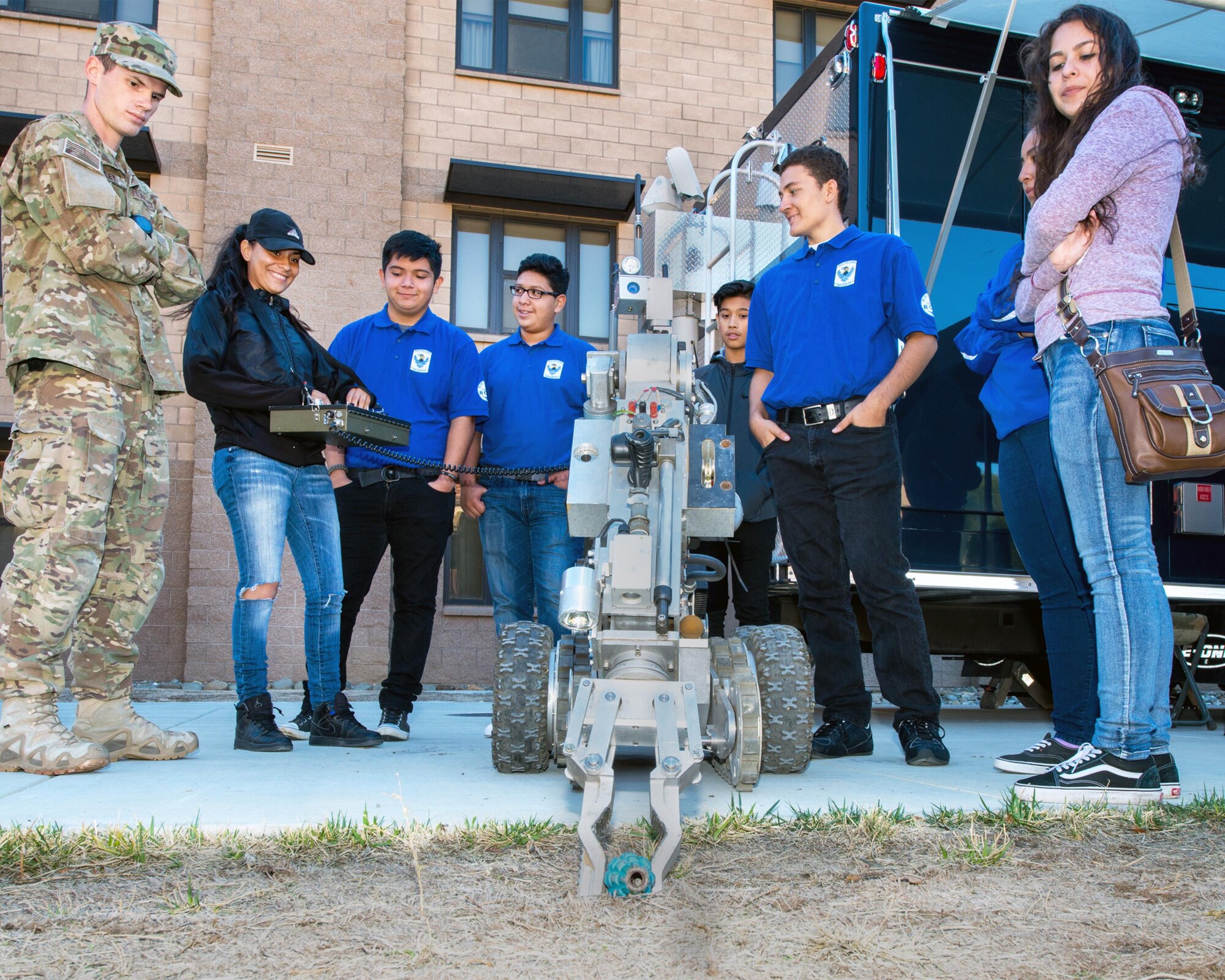 U.S. Air Force Senior Airman Taylor Finley, 60th Civil Engineer Squadron, shows students from Valley High School in Sacramento, Calif., how to use the F-6A Robot during their tour at Travis Air Force Base, Calif., Oct. 20, 2016. Travis hosted Junior Reserve Officer Training Corps students from five high schools in Northern Calif. Students toured several aircraft, air traffic control tower, dormitories, and had the opportunity to talk with personnel about military life. (U.S. Air Force photo by Louis Briscese)