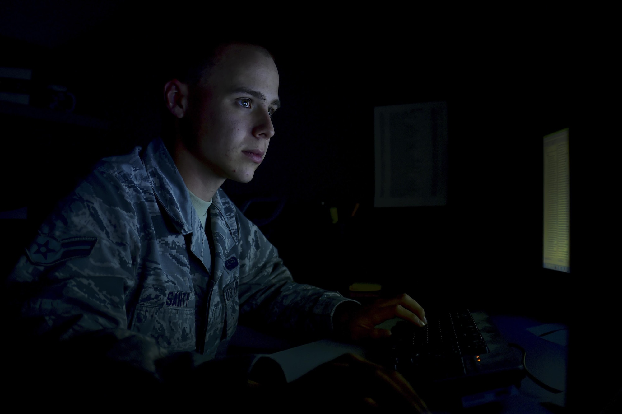 Airman 1st Class Tyler C. Santy, 460th Space Communication Squadron network administrator, reviews information Oct. 20, 2016, at Buckley Air Force Base, Colo. As a network administrator, Santy is responsible for maintaining the security of the installation’s networks. (U.S. Air Force photo by Airman Holden S. Faul/ Released)