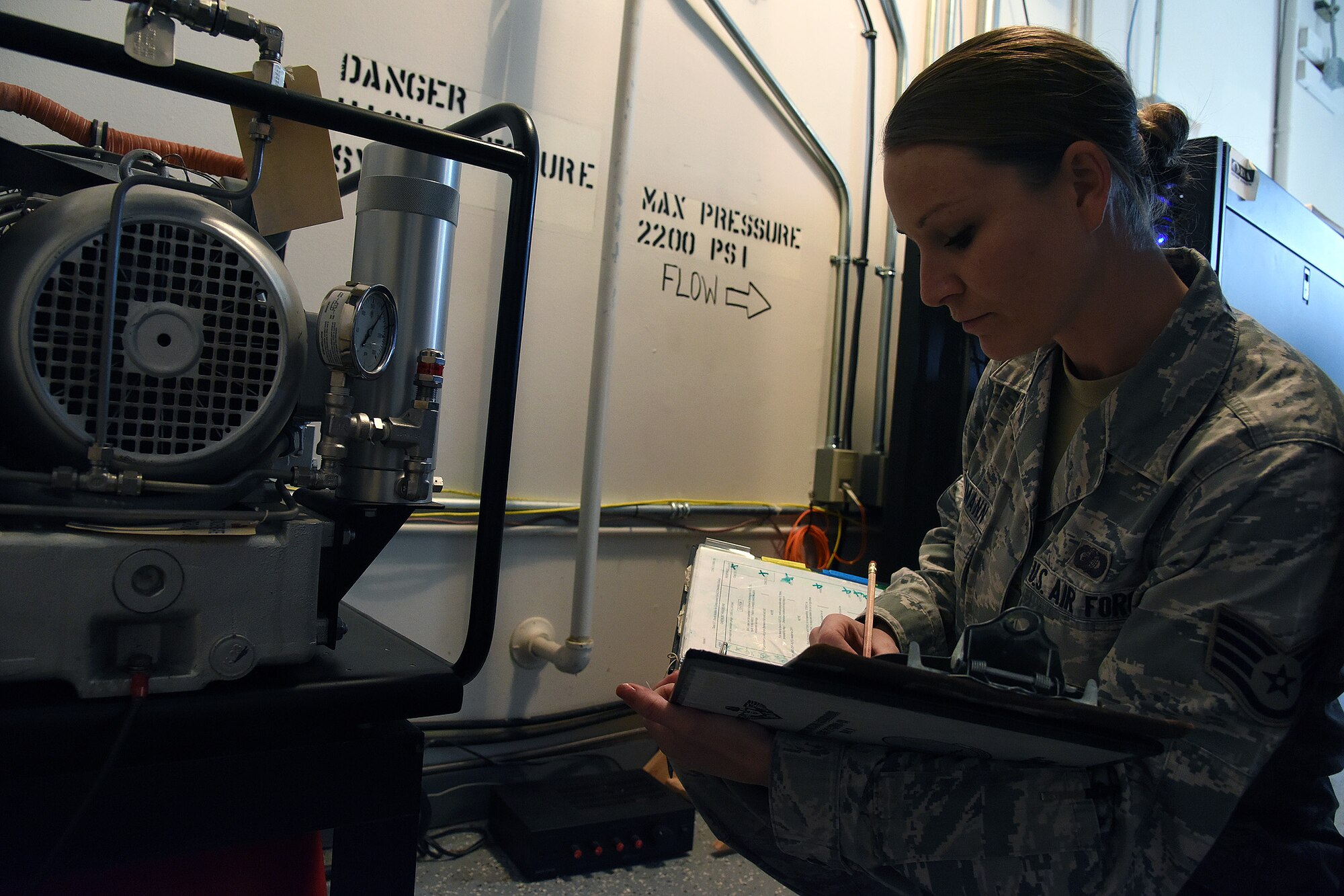 Staff Sgt. Tara Kindermann, 490th Missile Squadron facility manager, reviews a daily checklist at a missile alert facility Oct. 19, 2016, at Malmstrom Air Force Base, Mont. The FMs conduct daily, quarterly, bi-annually and annual checks of the MAFs. (U.S. Air Force Base/Senior Airman Jaeda Tookes)

