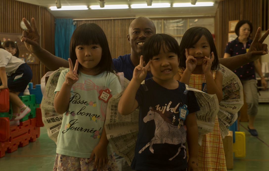 U.S. Marine Corps GySgt. Raetheon W. Mitchell, a motor transportation maintenance chief at Garrison Mobile Equipment, Marine Corps Base Smedley Butler, III Marine Expeditionary Force, visits Chatan-Daini Kindergarten to give back to the community in Okinawa, Japan, Oct. 26, 2016. The Marines were able to show the local children the similarities between the U.S. and Japanese cultures through a variety of games and books. (U.S. Marine Corps photo by Lance Cpl. Kelsey Dornfeld)