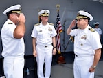 POLARIS POINT, Guam (Oct. 21, 2016) Capt. Douglas A. Bradley, right, relieves Capt. Mark A. Prokopius, left, as commanding officer of the submarine tender USS Emory S. Land (AS 39) as Rear Adm. Frederick J. Roegge, commander of Submarine Force, U.S. Pacific Fleet, presides. The change-of-command ceremony was held aboard Emory S. Land. (U.S. Navy photo by Seaman Daniel S. Willoughby/RELEASED) 
