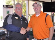 Jim Broughton, 72nd Force Support Squadron Tinker golf course manager, congratulates Lt. Col. Casey Grider, director of operations with the 752nd Operations Support Squadron Air Combat Command. Grider shot 170 yards for a hole-in-one for hole #2 during the Can-Am (Canadian American) Tournament on Oct. 21. This is the first hole-in-one made during a tournament at the Tinker golf course in 15 years, winning Grider a $5,000 cash prize. (Air Force photo by Cynthia Wright)