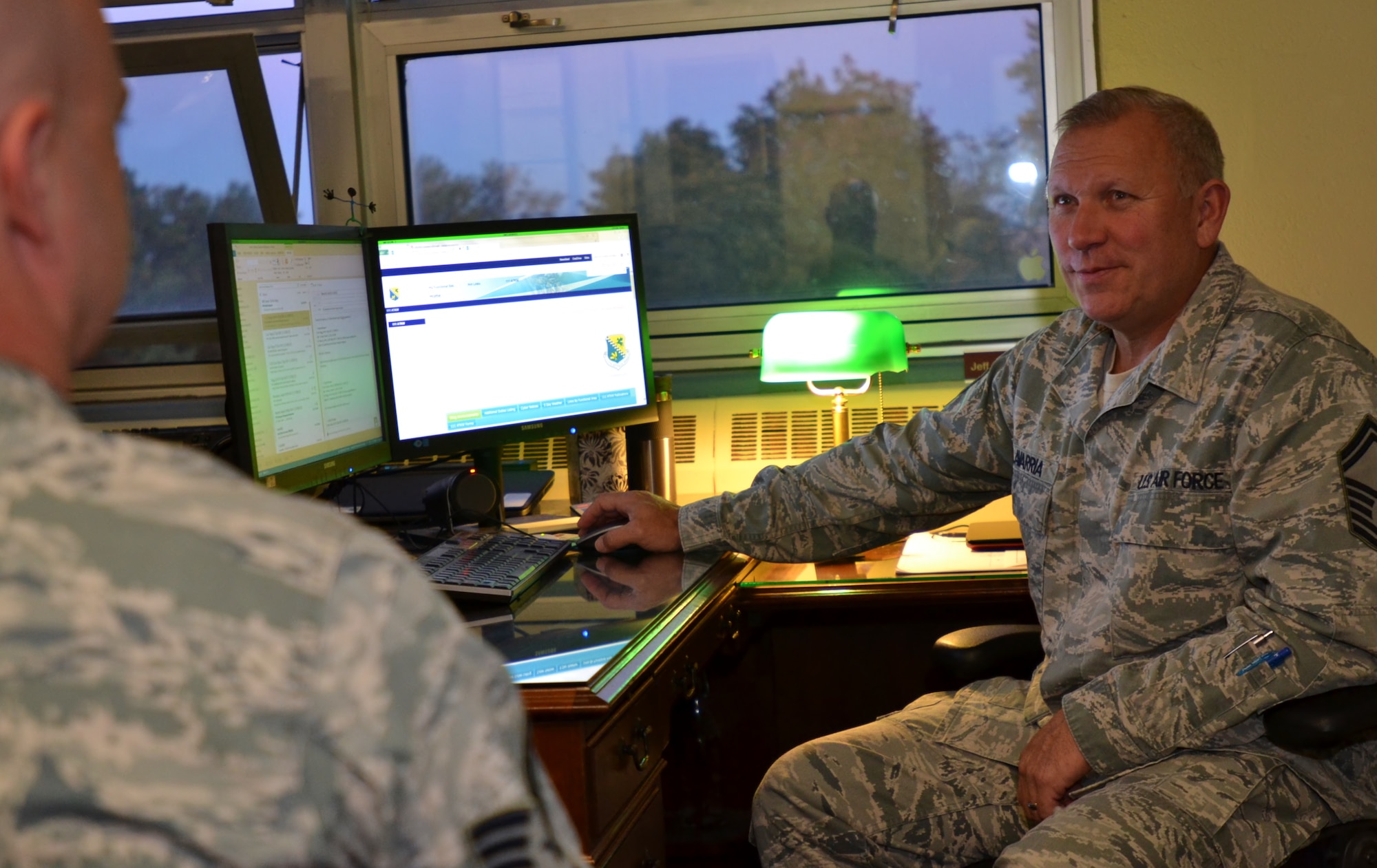 Senior Master Sgt. Jeffery Olavarria, 111th Logistics Readiness Squadron readiness flight superintendent, speaks to a 111th Attack Wing member about current deployment operations within the Wing at Horsham Air Guard Station, Pa. Oct. 26, 2016. Members of the 111th LRS are responsible for ensuring all members have met Air Force compliance before outprocessing to the deployed location. (U.S. Air National Guard photo by Tech. Sgt. Andria Allmond)
