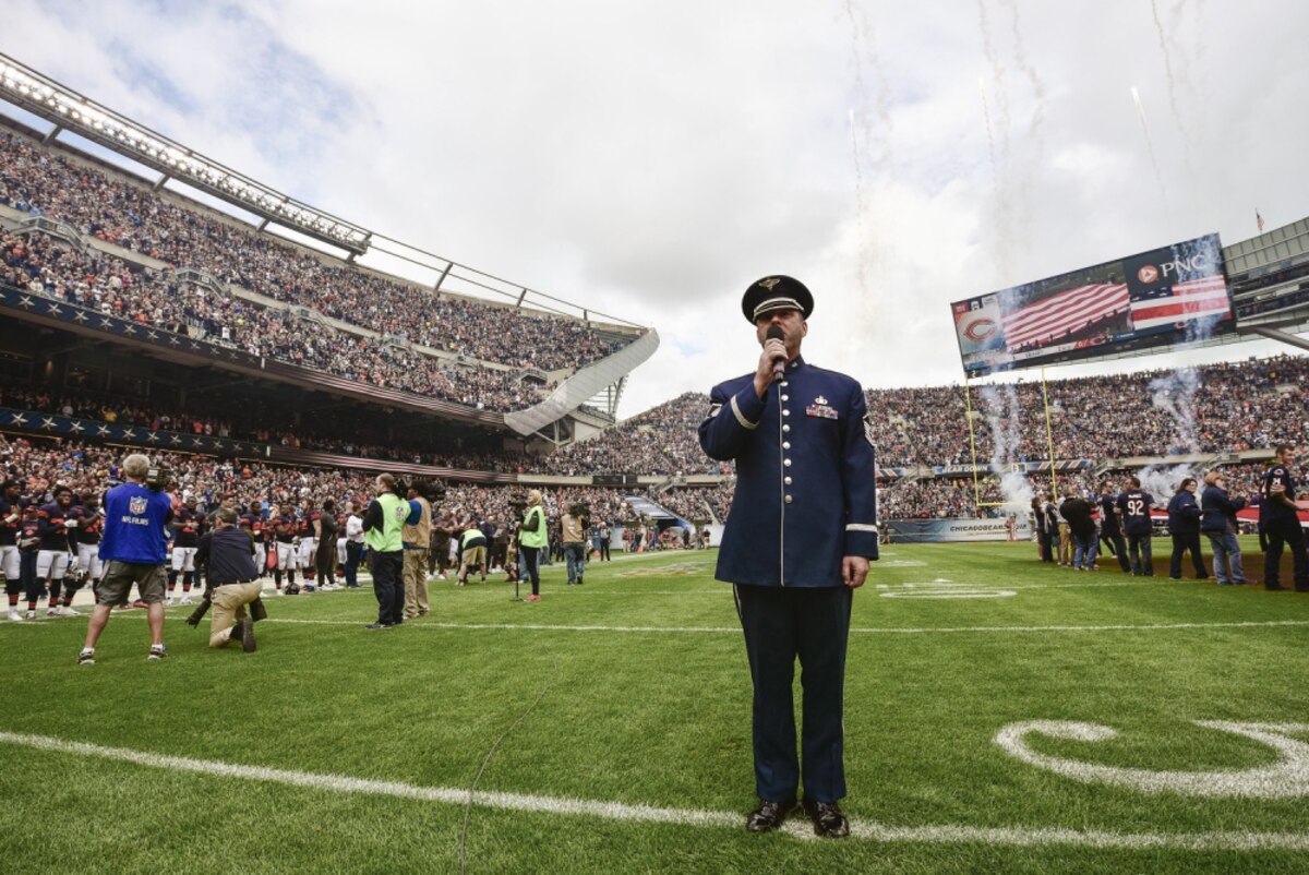 U.S. Air Force Master Sgt. Eric Sullivan, a baritone vocalist with the United States Air Force Band’s “Singing Sergeants”, sings “The Star-Spangled Banner” before an NFL football game at Soldier Field in Chicago, Ill., Oct. 2, 2016. Sullivan performed the national anthem for an audience of more than 60,800 people as part of the unit’s community relations mission. (U.S. Air National Guard photo by Tech. Sgt. Lealan Buehrer)