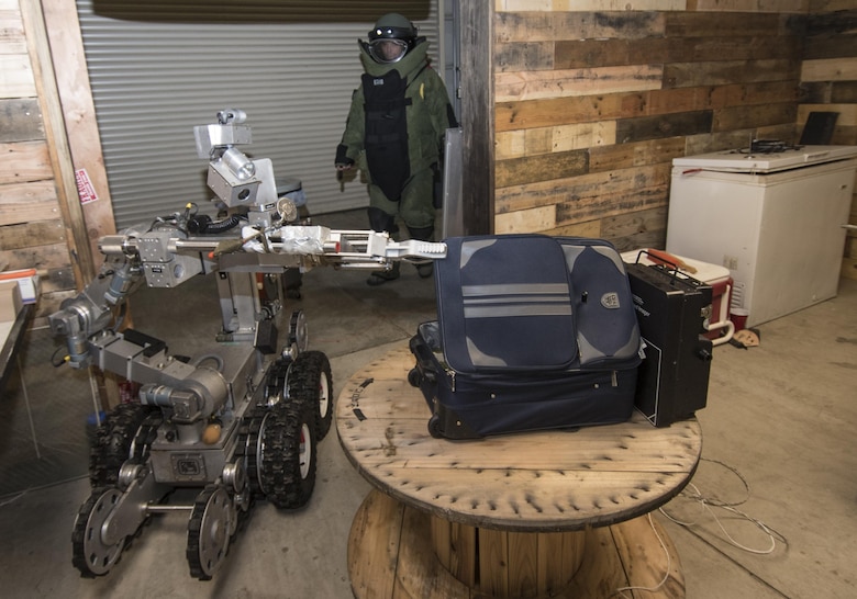 U.S. Air Force Staff Sgt. Matthew Morris, an explosive ordnance disposal technician with the 35th Civil Engineer Squadron, enters an improvised explosive device training scenario at Misawa Air Base, Japan, Oct. 20, 2016. Personnel work together with reconnaissance robots to help locate, disarm and remove IEDs, with returning the scene to normal as their goal, as if the device were never present. (U.S. Air Force photo by Airman 1st Class Sadie Colbert)
