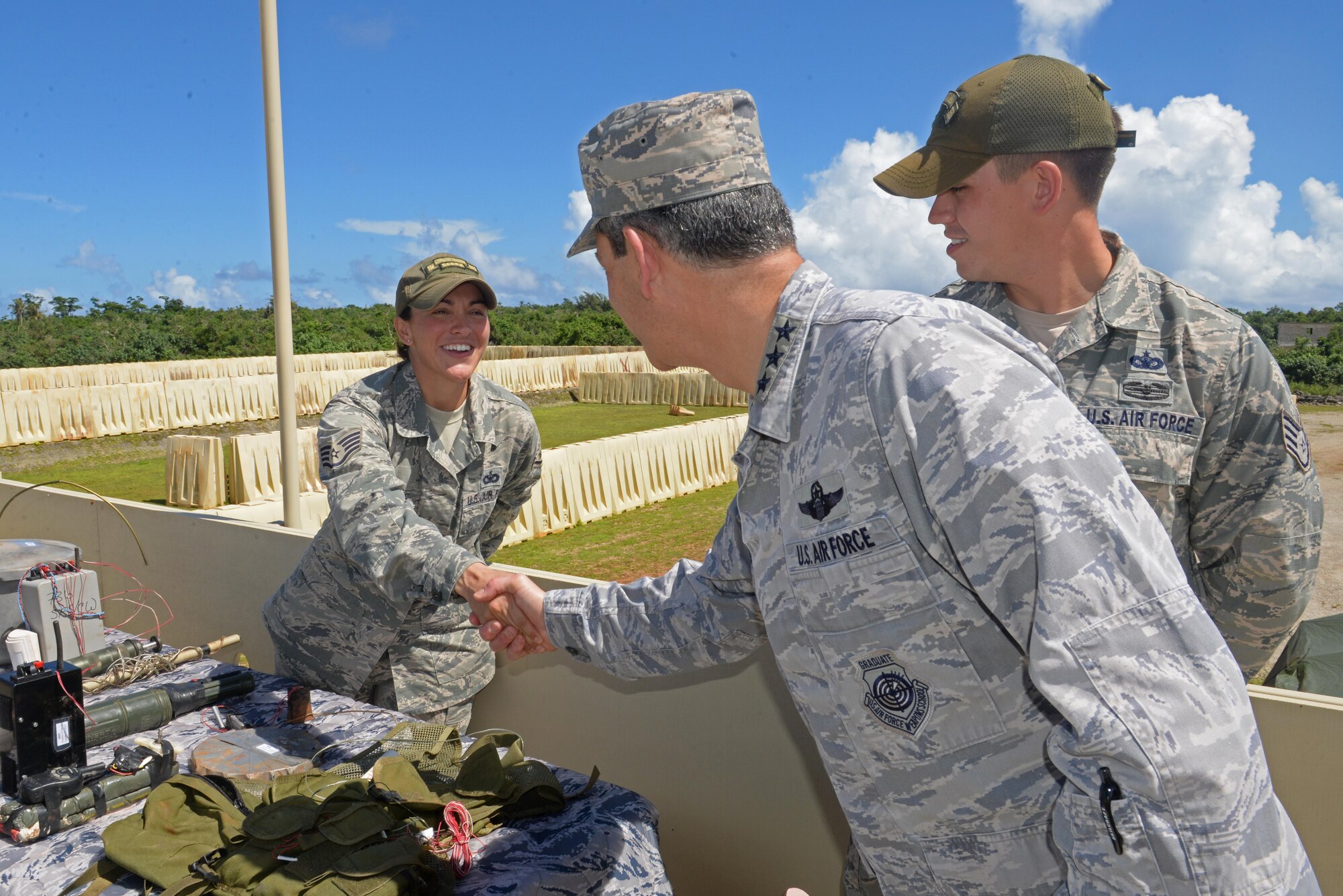 U.S. Air Force Lt. Gen. Kenneth Wilsbach, 11th Air Force commander, greets Staff Sgt. Chelsey Coolidge, left, 736th Security Forces Squadron commando warrior instructor, Oct. 27, 2016, at Andersen Air Force Base, Guam. During his visit, Wilsbach met with Airmen and hosted an all call where he spoke with Airmen and answered their questions. (U.S. Air Force photo by Airman 1st Class Alexa Ann Henderson)