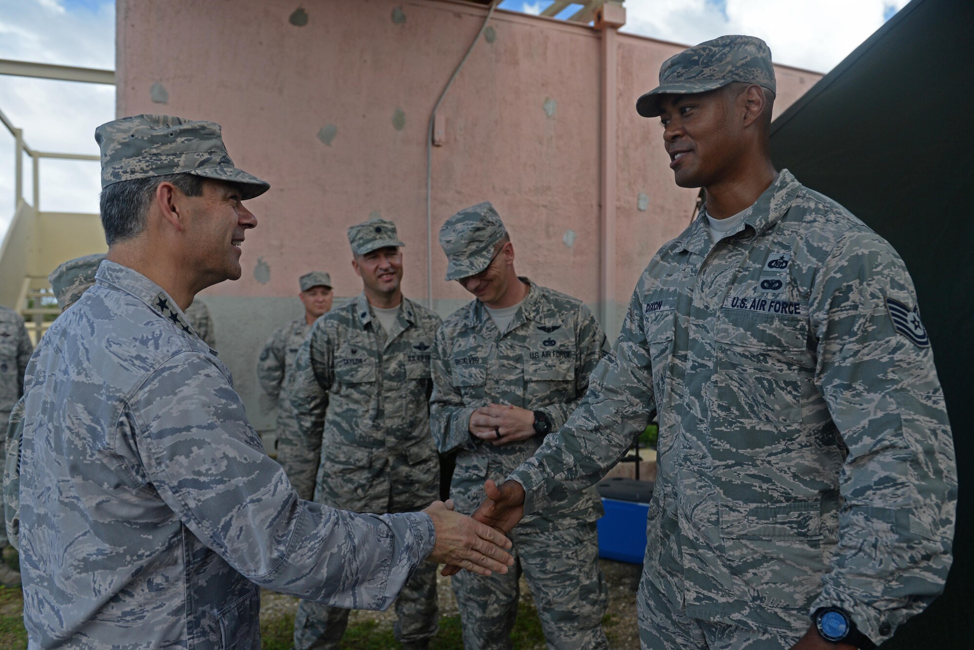 U.S. Air Force Lt. Gen. Kenneth Wilsbach, 11th Air Force commander, greets Tech Sgt. Dan Dixon, 36th Mobility Readiness Squadron NCO in charge of mobile command control, Oct. 27, 2016, at Andersen Air Force Base, Guam. Dixon briefed Wilsbach on the 36th MRS missions and accomplishments in the Pacific Theater to include multiple deployments to multiple locations. (U.S. Air Force photo by Airman 1st Class Alexa Ann Henderson)