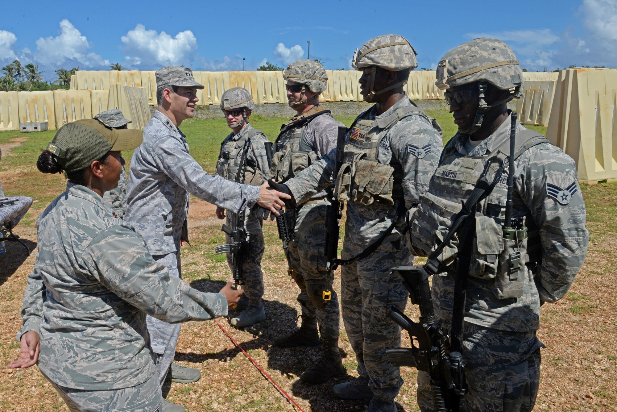 U.S. Air Force Lt. Gen. Kenneth Wilsbach, 11th Air Force commander, greets a team of 736th Security Forces Squadron Airmen after they demonstrated a combat scenario Oct. 27, 2016, at Andersen Air Force Base, Guam. The scenario included an improvised exploding device and enemy fire. (U.S. Air Force photo by Airman 1st Class Alexa Ann Henderson) 
