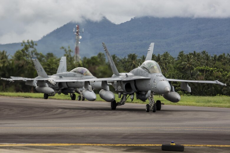 Two U.S. Marine Corps F/A-18D Hornets with Marine All-Weather Fighter Attack Squadron (VMFA (AW)) 225, taxi down the runway upon arrival to Sam Ratulangi International Airport, Indonesia, in preparation of exercise Cope West 17, Oct. 27, 2016. This fighter-focused, bilateral exercise between the U.S. Marine Corps and Indonesian Air Force is designed to enhance the readiness of combined interoperability between the two nations. (U.S. Marine Corps photo by Lance Cpl. Aaron Henson)