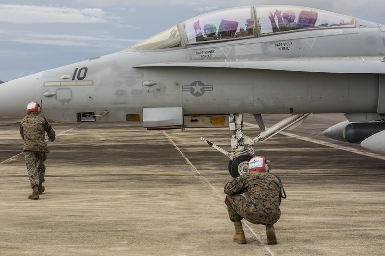 Sgt. Matthew Dailey, right, and Sgt. Zachary Wilde, left, ordnance technicians with Marine All-Weather Fighter Attack Squadron (VMFA (AW)) 225, disarm an F/A-18D Hornet with VMFA(AW) 225, upon its arrival at Sam Ratulangi International Airport, Indonesia, in preparation of exercise Cope West 17, Oct. 27, 2016. This fighter-focused, bilateral exercise between the U.S. Marine Corps and Indonesian Air Force is designed to enhance the readiness of combined interoperability between the two nations. The squadron plans to complete their unit air-to-air training requirements, which focuses on basic fighter maneuvering, section engaged maneuvering, offensive anti-air warfare and active air defense versus the Indonesian Air Force to increase situational readiness, interoperability, knowledge and partnership between the U.S. and Indonesia. (U.S. Marine Corps photo by Lance Cpl. Aaron Henson)