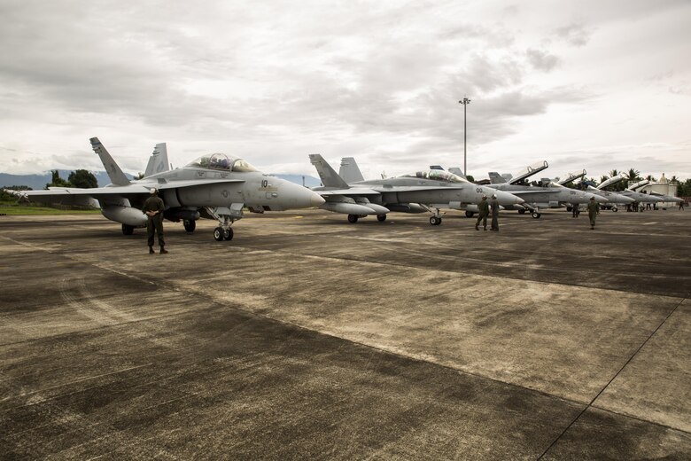 U.S. Marine Corps F/A-18D Hornets with Marine All-Weather Fighter Attack Squadron (VMFA (AW)) 225, arrive at Sam Ratulangi International Airport, Indonesia, in preparation of exercise Cope West 17, Oct. 27, 2016. This fighter-focused, bilateral exercise between the U.S. Marine Corps and Indonesian Air Force is designed to enhance the readiness of combined interoperability between the two nations. The squadron plans to complete their unit air-to-air training requirements, which focuses on basic fighter maneuvering, section engaged maneuvering, offensive anti-air warfare and active air defense versus the Indonesian Air Force to increase situational readiness, interoperability, knowledge and partnership between the U.S. and Indonesia. (U.S. Marine Corps photo by Lance Cpl. Aaron Henson)