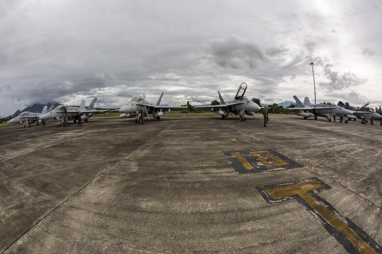 U.S. Marine Corps F/A-18D Hornets with Marine All-Weather Fighter Attack Squadron (VMFA (AW)) 225, arrive at Sam Ratulangi International Airport, Indonesia, in preparation of exercise Cope West 17, Oct. 27, 2016. This fighter-focused, bilateral exercise between the U.S. Marine Corps and Indonesian Air Force is designed to enhance the readiness of combined interoperability between the two nations. Cope West 17 is the first fighter-focused exercise in 19 years involving the U.S. Marine Corps and Indonesian Air Force. (U.S. Marine Corps photo by Lance Cpl. Aaron Henson)
