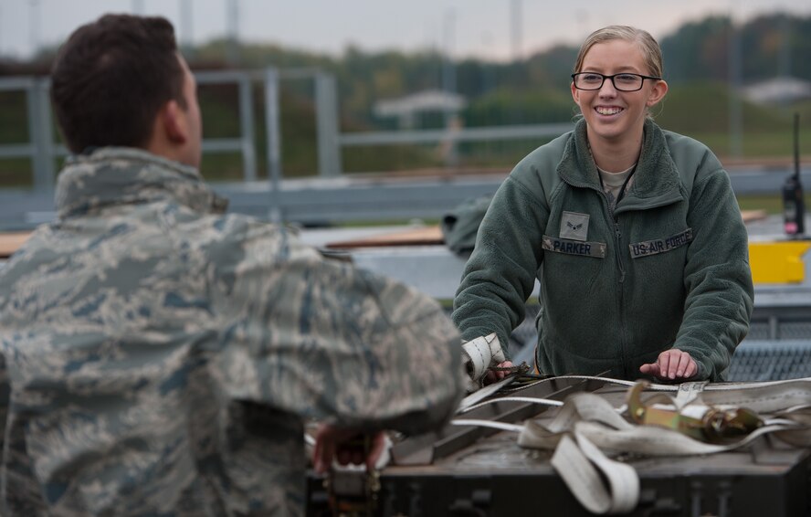Airman 1st Class Della Parker, 86th Munitions Squadron munitions storage crew member, helps another 86th MUNS Airman secure boxes of ammunition during an exercise at Ramstein Air Base, Germany, Oct. 25, 2016. Although the exercise demanded more from the Airmen, they tested their ability to cooperate together in a more stressful environment, building team chemistry for when real-world events occur. (U.S. Air Force photo by Airman 1st Class Lane T. Plummer)