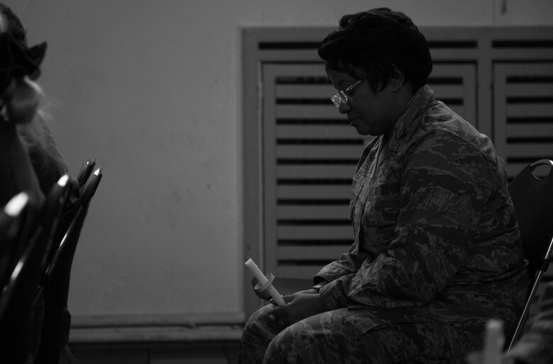 Col. Donnette Boyd, 86th Airlift Wing chaplain, holds a moment of silence to remember the victims of interpersonal violence during a candlelight vigil at Ramstein Air Base, Germany, Oct. 27, 2016. According to the Center for Disease Control and Prevention, over the course of a year, more than 10 million U.S. citizens are victims of domestic violence, sexual abuse, child violence and bullying or suicide. The devastating physical, emotional, and psychological consequences of interpersonal violence can cross generations and last lifetimes. (U.S. Air Force photo by Airman 1st Class Lane T. Plummer)