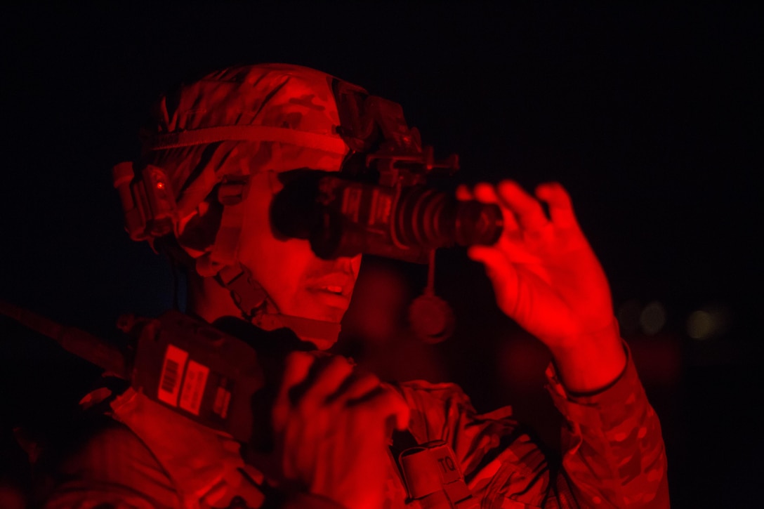 A U.S. Soldier assigned to the 39th Brigade Engineering Battalion, 101st Airborne Division (Air Assault), adjusts his night vision goggles at Qayyarah West Airfield, Oct. 25, 2016. More than 60 coalition partners have committed themselves to the goals of eliminating the threat posed by the Islamic State of Iraq and the Levant and have contributed in various capacities to the effort to combat ISIL in Iraq, the region and beyond.  (U.S. Army photo by Spc. Christopher Brecht)