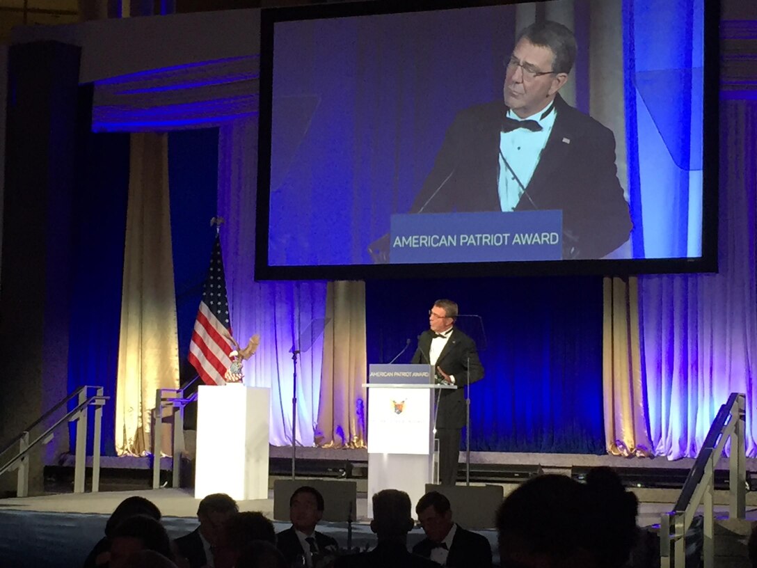Defense Secretary Ash Carter thanks the National Defense University Foundation for recognizing the men and women of the Defense Department with the Patriot Award during a ceremony at the Reagan Building in Washington Oct. 27, 2016. DoD photo by Jim Garamone