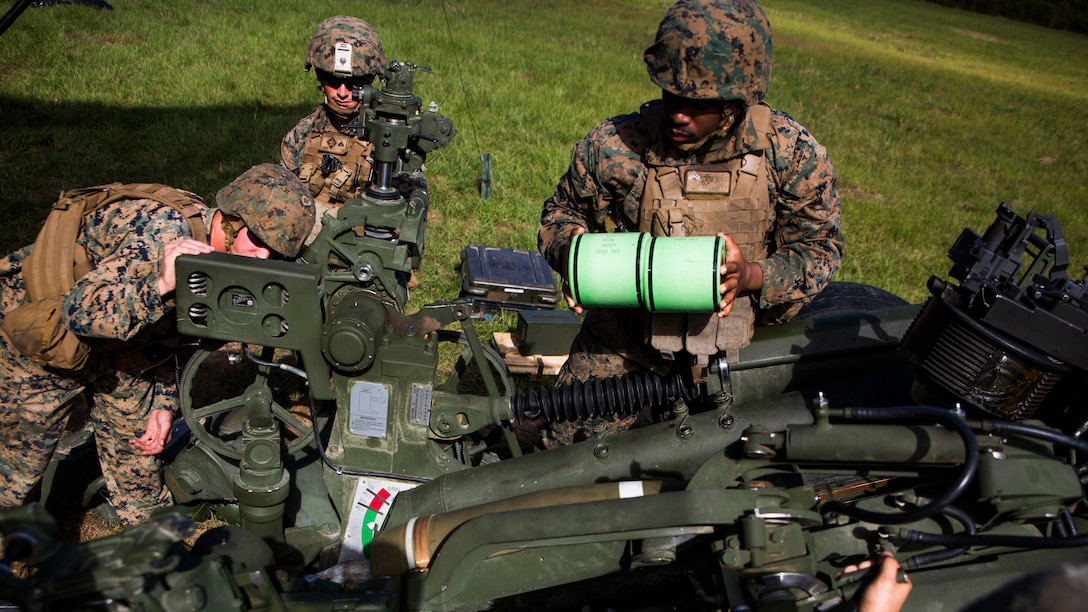 U.S. Marines load a M777 lightweight Howitzer during a Tactical Air Control Party exercise at Camp Lejeune, N.C., Oct. 20, 2016. The Howitzers can mark the location of a target within 200-300 meters with either a white phosphorus or illumination round.