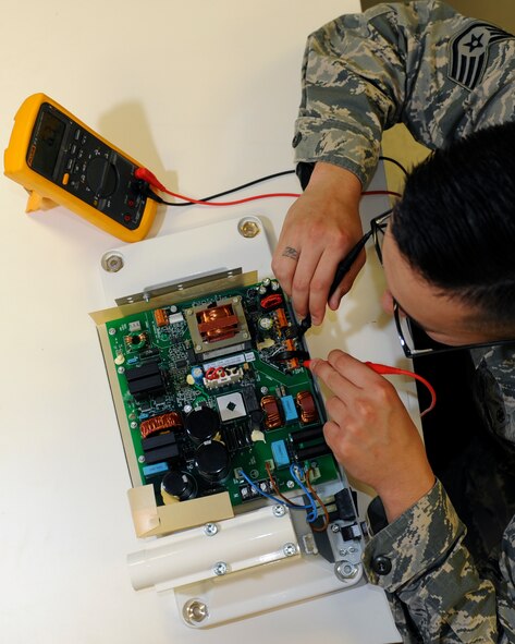U.S. Air Force Staff Sgt. Pablo Novel-Valdez, a biomedical equipment technician with the 509th Medical Support Squadron, checks the settings of a dental x-ray power board at Whiteman Air Force Base, Mo., Oct. 13, 2016. Each item at the medical group facility is checked for compliance prior to patient use. (U.S. Air Force photo by Senior Airman Danielle Quilla)