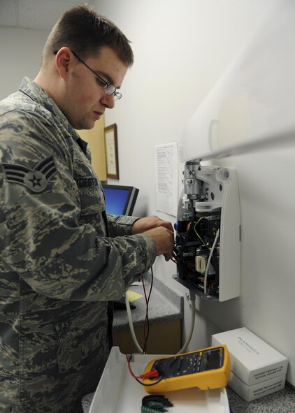 U.S. Air Force Senior Airman Lance Voegtline, a biomedical equipment technician (BMET) with the 509th Medical Support Squadron, inspect a power board for a dental x-ray machine at Whiteman Air Force Base, Mo., Oct. 13, 2016. BMETs stay up-to-date on industry leading equipment and they use this knowledge to review and approve all medical equipment that is assigned to the clinic. (U.S. Air Force photo by Senior Airman Danielle Quilla)