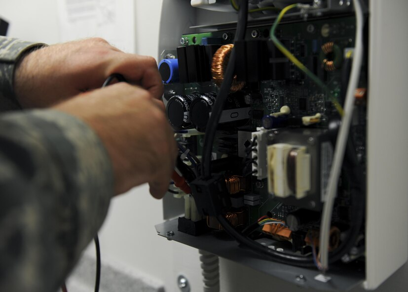 U.S. Air Force Senior Airman Lance Voegtline, a biomedical equipment technician with the 509th Medical Support Squadron, calibrates a dental x-ray power board at Whiteman Air Force Base, Mo., Oct. 13, 2016. The equipment items assigned to the medical group are inspected against manufacture, National Fire Protection Association and industry standards (U.S. Air Force photo by Senior Airman Danielle Quilla) 