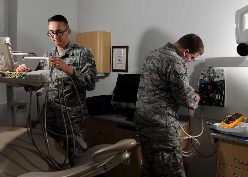 U.S. Air Force Staff Sgt. Pablo Novel-Valdez, left, and Senior Airman Lance Voegtline, biomedical equipment technicians (BMET) with the 509th Medical Support Squadron, inspect dental equipment at Whiteman Air Force Base, Mo., Oct. 13, 2016. BMETs are responsible for ensuring approximately 1,043 equipment items at the medical group are functioning correctly. (U.S. Air Force photo by Senior Airman Danielle Quilla)