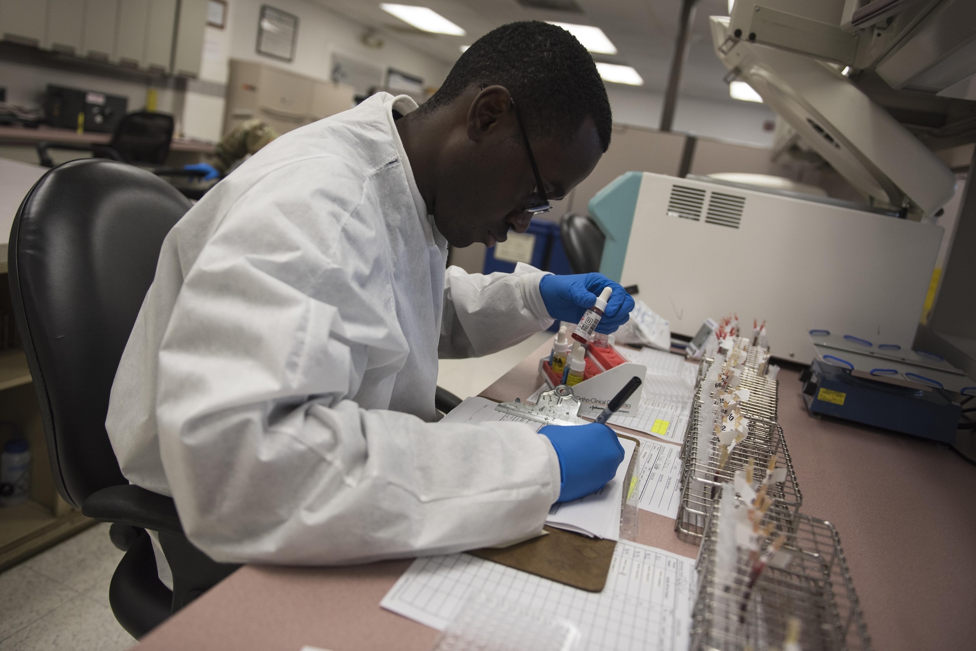 Hospital Corpsman Rony Pierre, ASWBPL-East laboratory technician, ensures correct blood type by testing samples of blood products at the ASWBPL, Joint Base McGuire-Dix-Lakehurst, N.J., Oct 21, 2016. The blood that pumps through the ASWBPL-East is shipped overseas to warfighters in need.